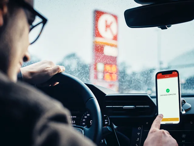 Driver using circle K app at circle k station