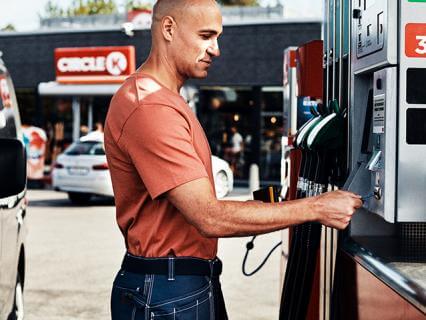 Man using fleet card at fuel pump