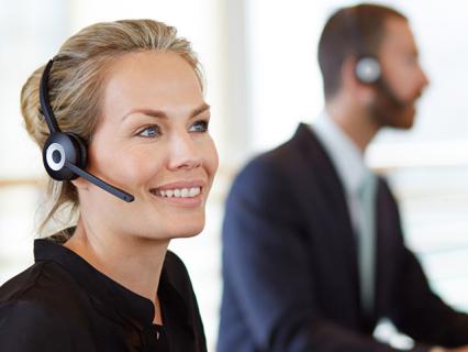 Customer service worker helping fleet card customer on phone