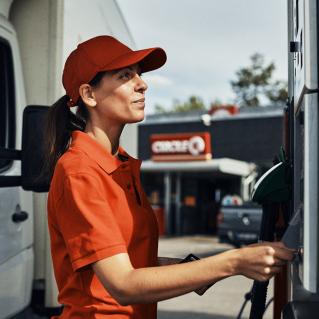 Driver selecting fuel type at Circle K station