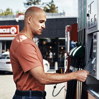 Driver using fleet card at fuel pump