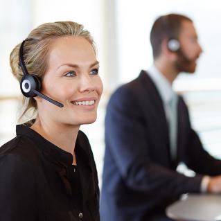 Customer service worker helping customer on phone